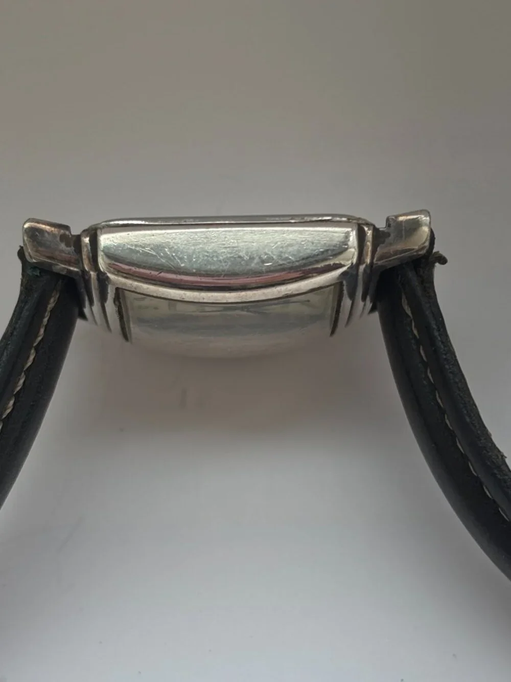 Vintage Fossil watch in Art Deco style with silver bezel and square face
